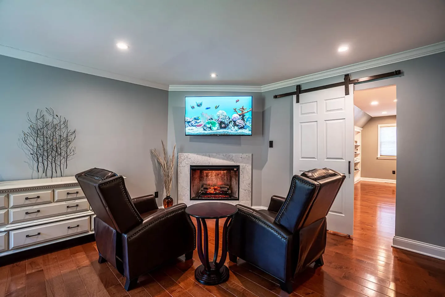 Two chairs close to a fireplace in North Wales