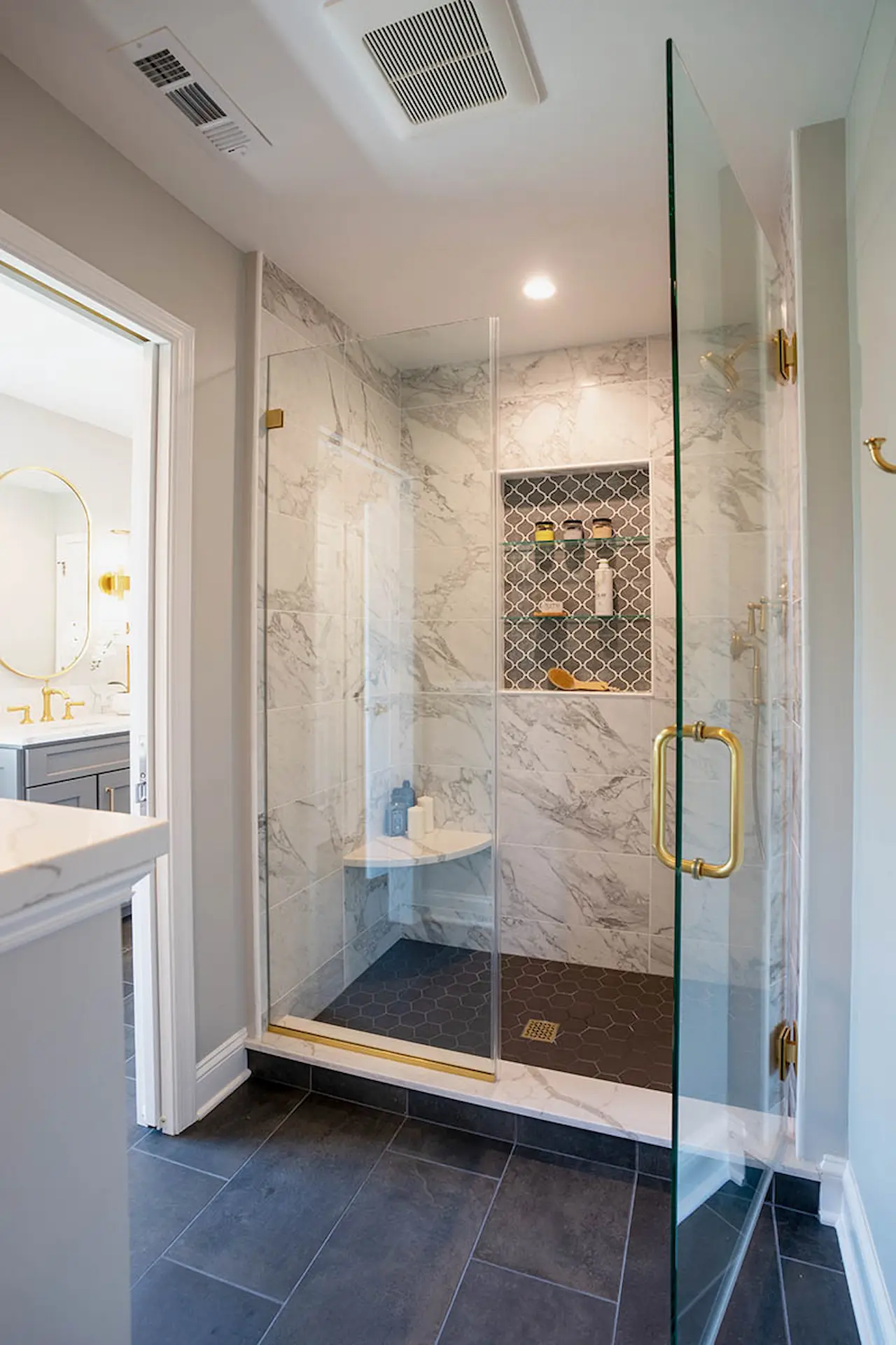 Far view of Lower Gwynedd Primary Bathroom's glass shower area with its door opened