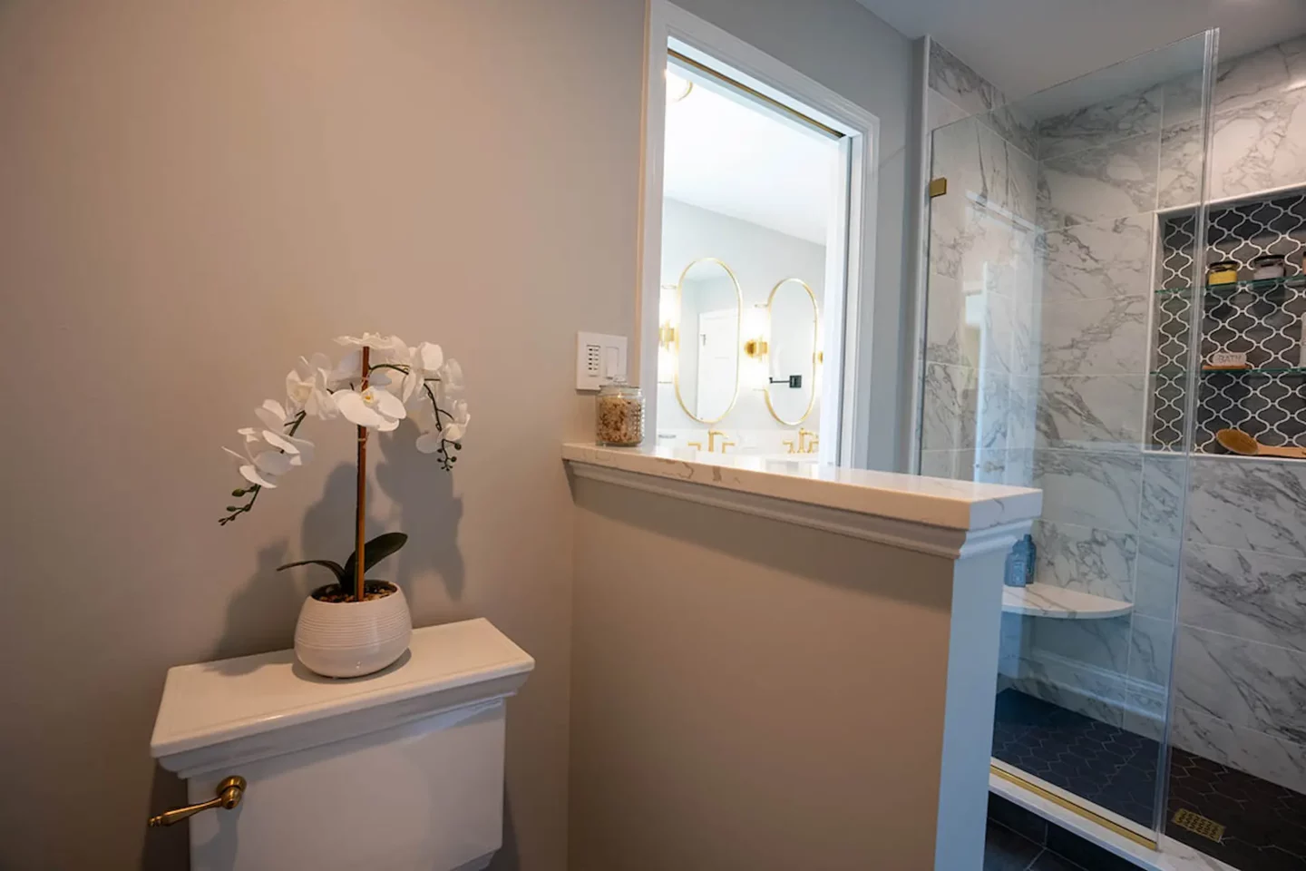 Flower vase nested close to a shower area in Lower Gwynedd Primary Bathroom