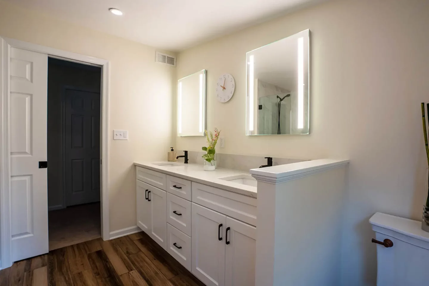 Smart mirrors hanging over a double-sink vanity in Lansdale bathroom sauna remodel