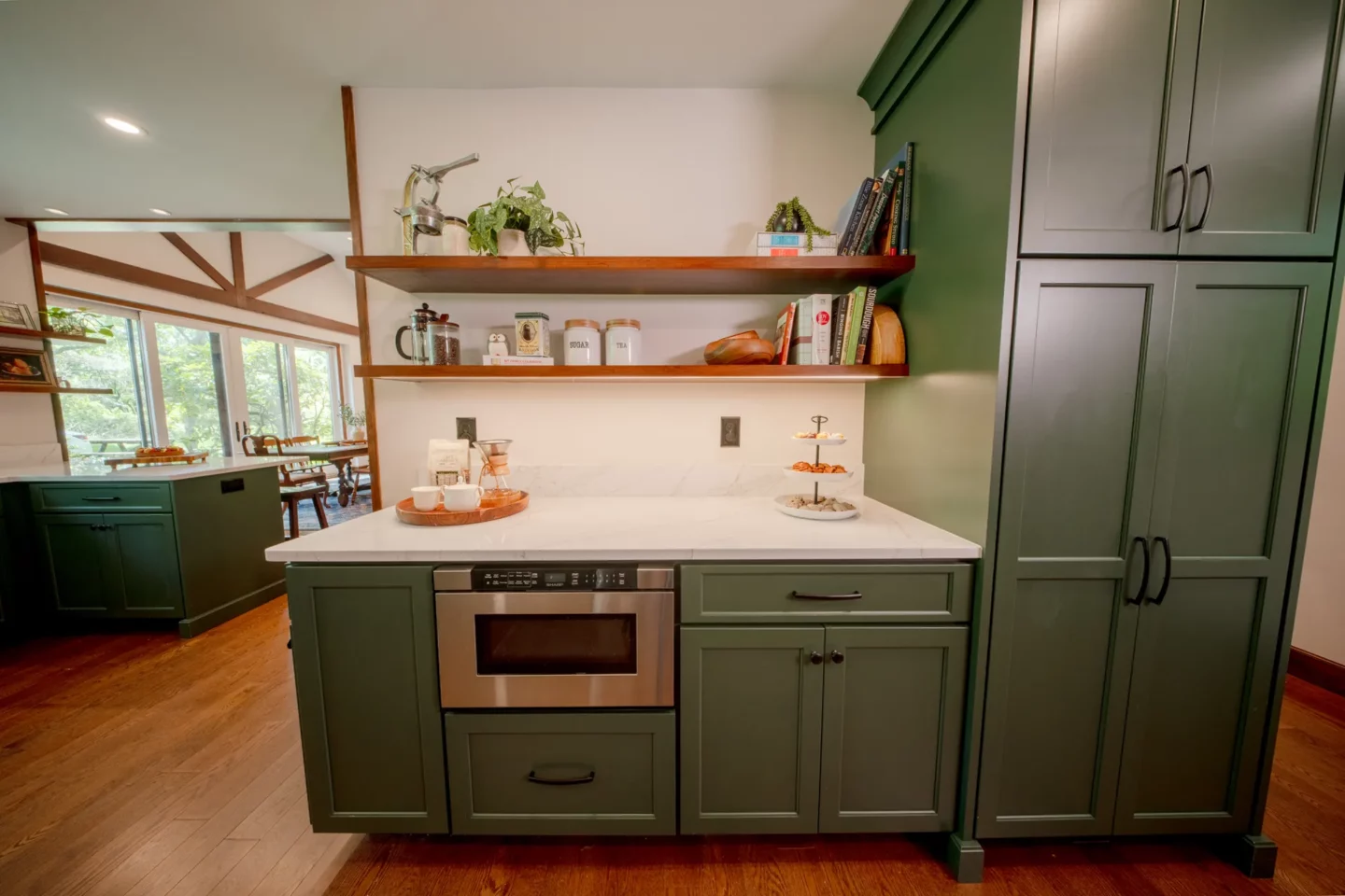 Coffee Bar with wood open shelves built-in microwave green cabinets