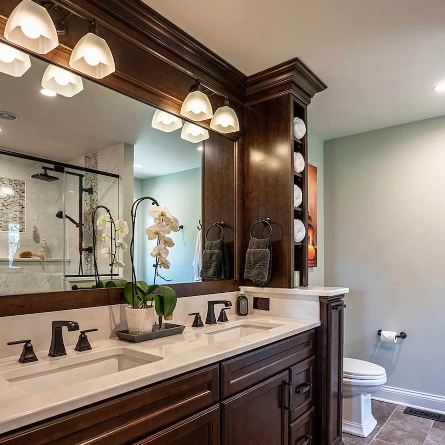 Flower vase on top of a double-sink vanity in North Wales bathroom