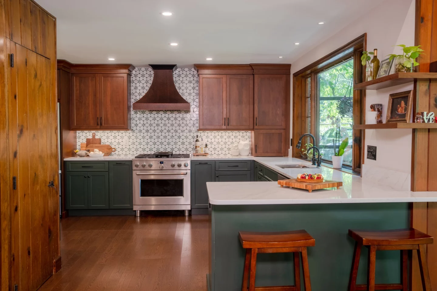 Custom kitchen featuring a handcrafted copper range hood, cherry cabinetry, Olympic Green island, and quartz countertops.