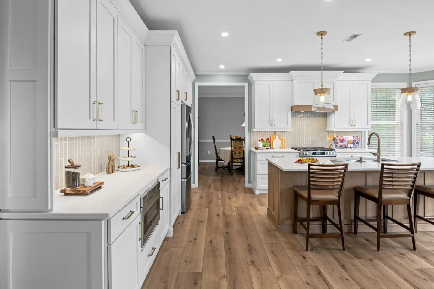 Tall flanking cabinets and an open sightline to the dining room in the Lansdale kitchen remodel