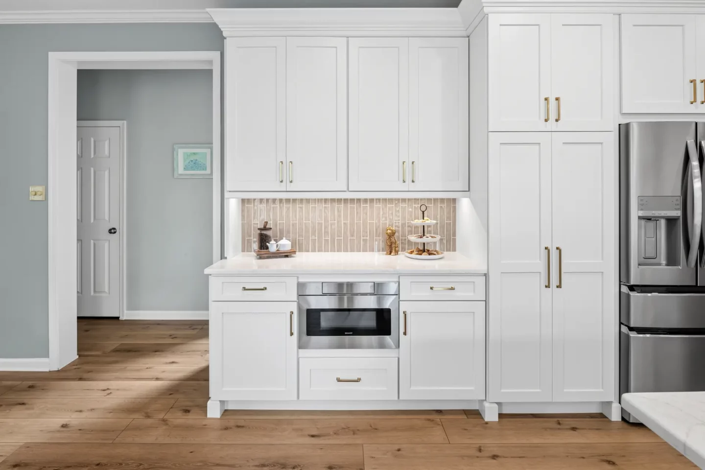 Tall pantry cabinets flanking the refrigerator in the Lansdale kitchen remodel