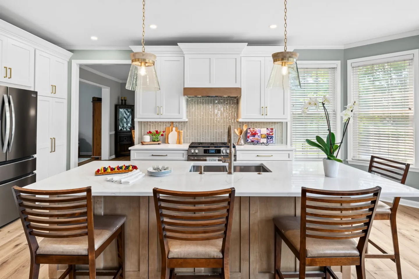 Oversized island with pendant lighting in the Lansdale kitchen remodel