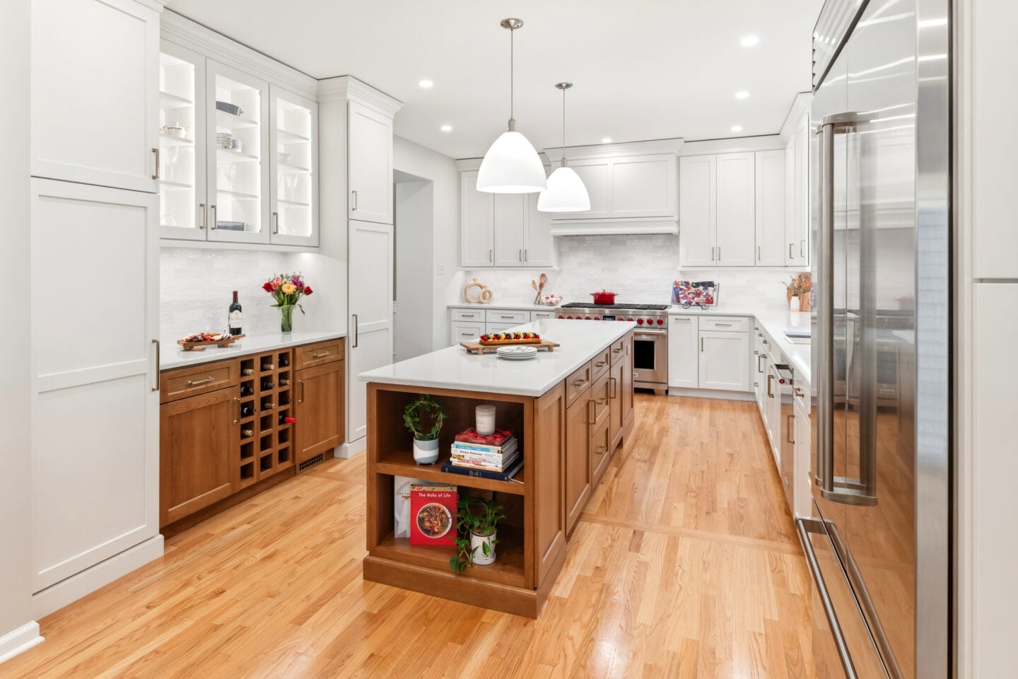 North Wales kitchen remodel featuring a stained wood island, white cabinetry, and quartz countertops